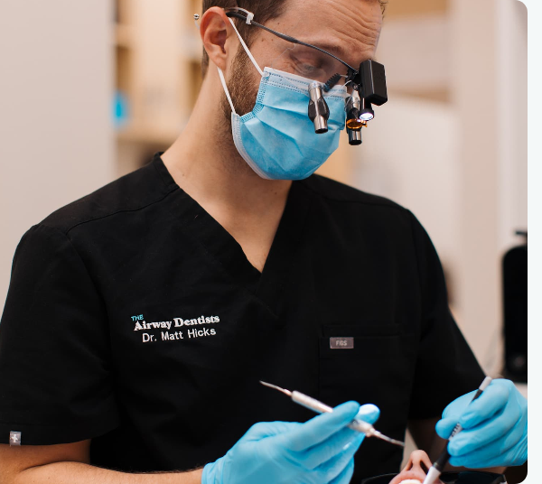 Dr. Matt Hicks wearing magnification loupes during a mercury-free filling appointment.