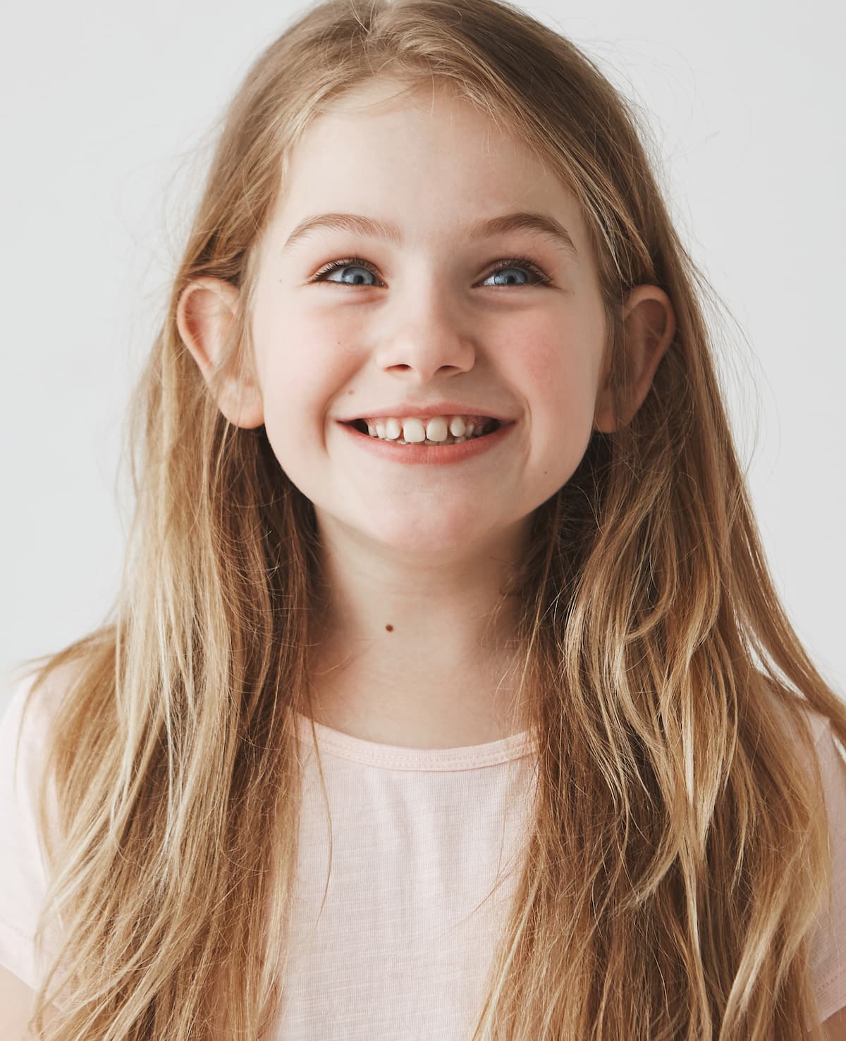 Smiling young girl in natural light